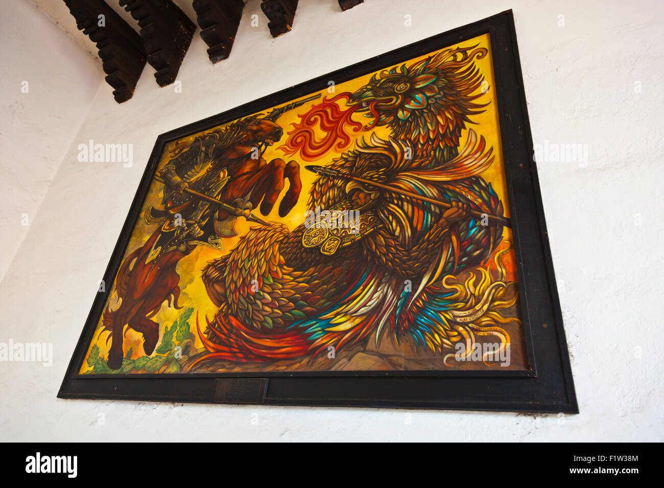 Painting of saint fighting dragon in government building oaxaca hires