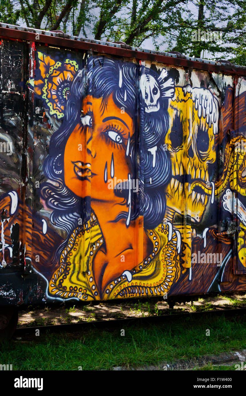 GRAFFITI ART of a crying woman and skull on a train car - OAXACA, MEXICO Stock Photo