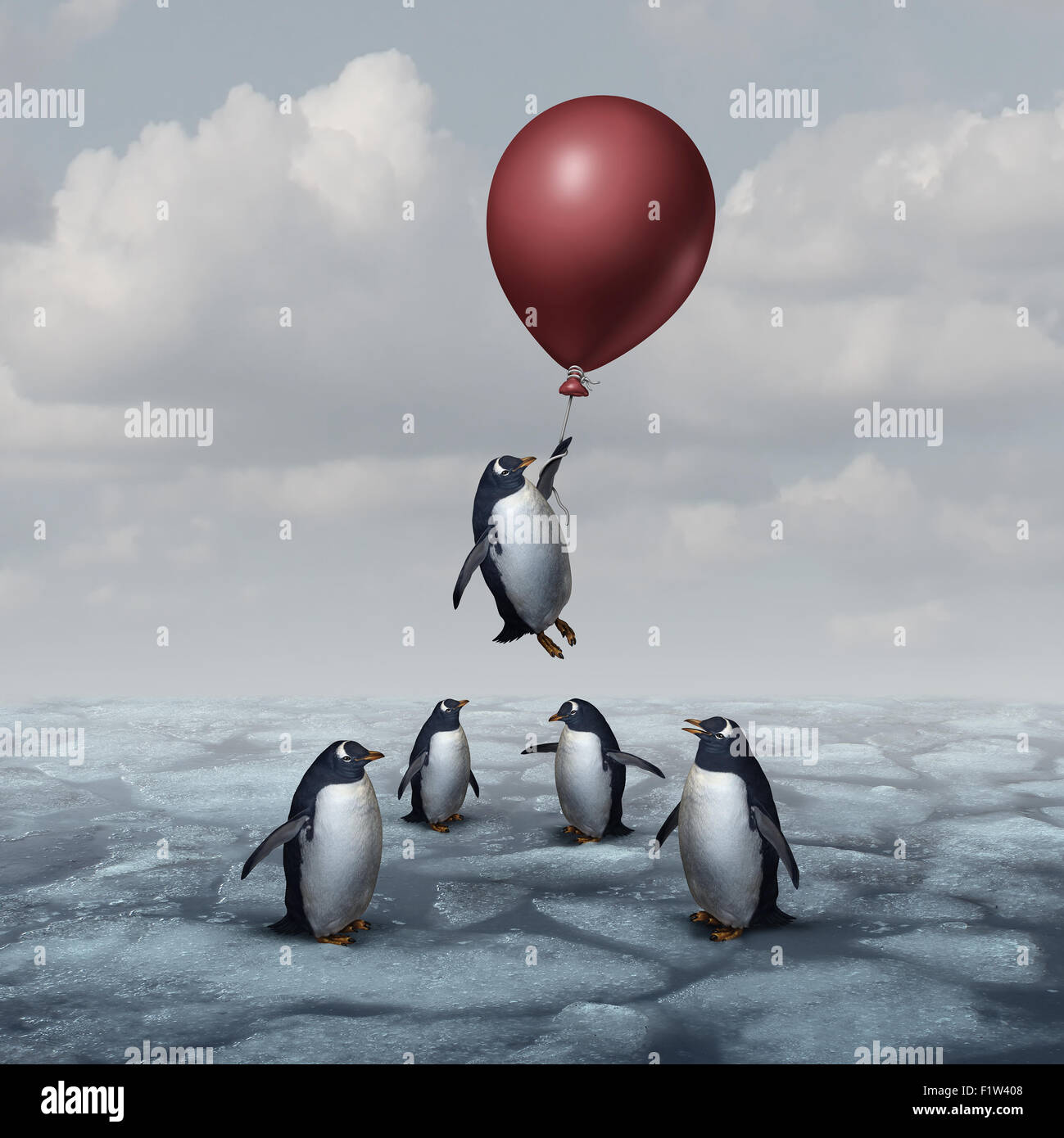 Advantage business concept and leadership innovation metaphor as a group of penguins standing on ice with one individual rising Stock Photo