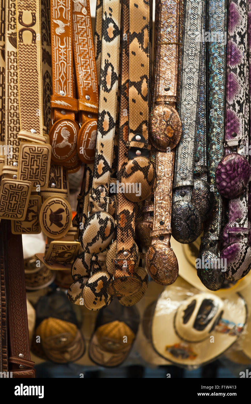 BELTS made from animal skins and for sale in the massive MERCADO DE ABASTOS - OAXACA, MEXICO Stock Photo