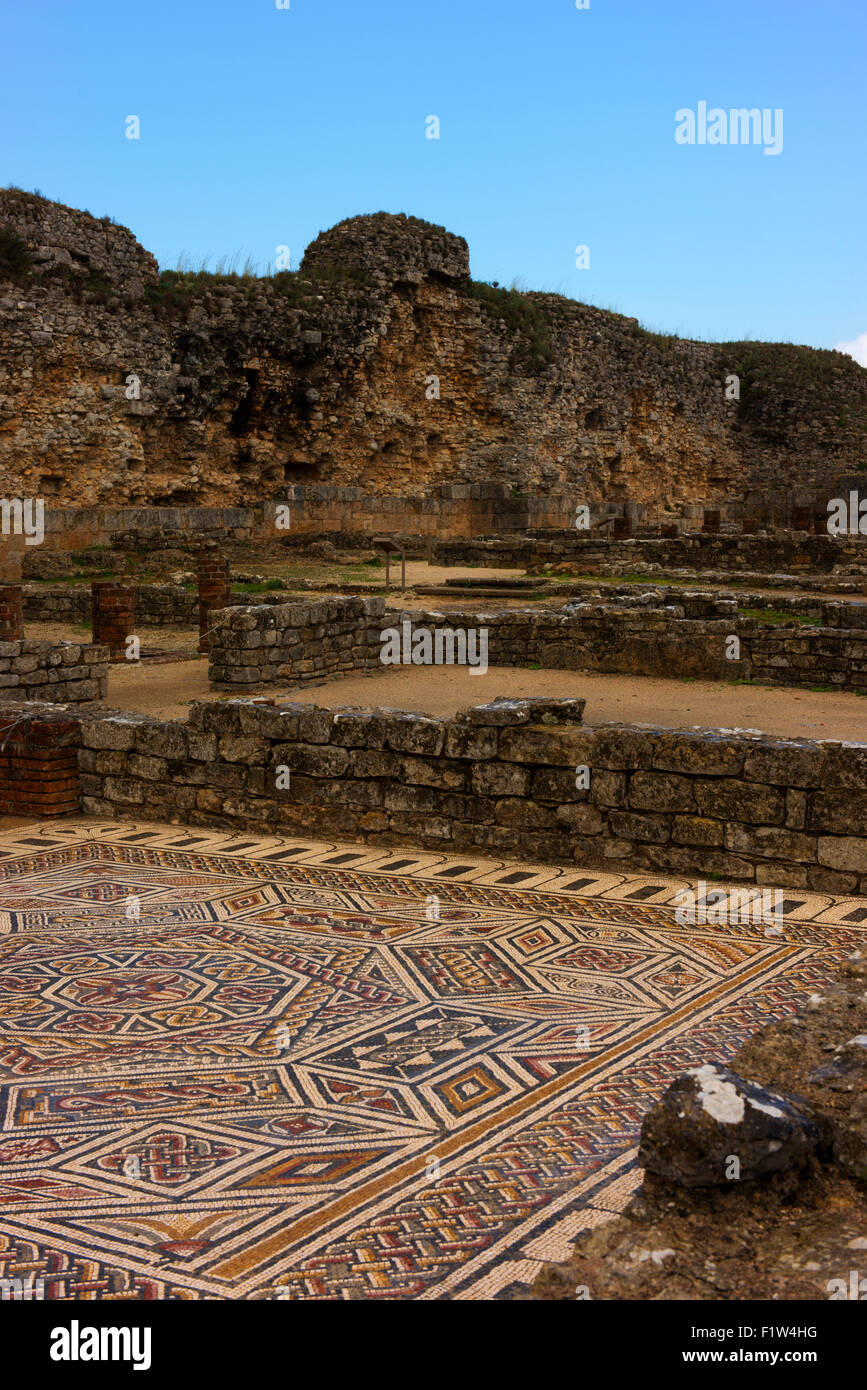 Mosaics and part of the original outer wall at Conimbriga, a former Roman settlement. Stock Photo