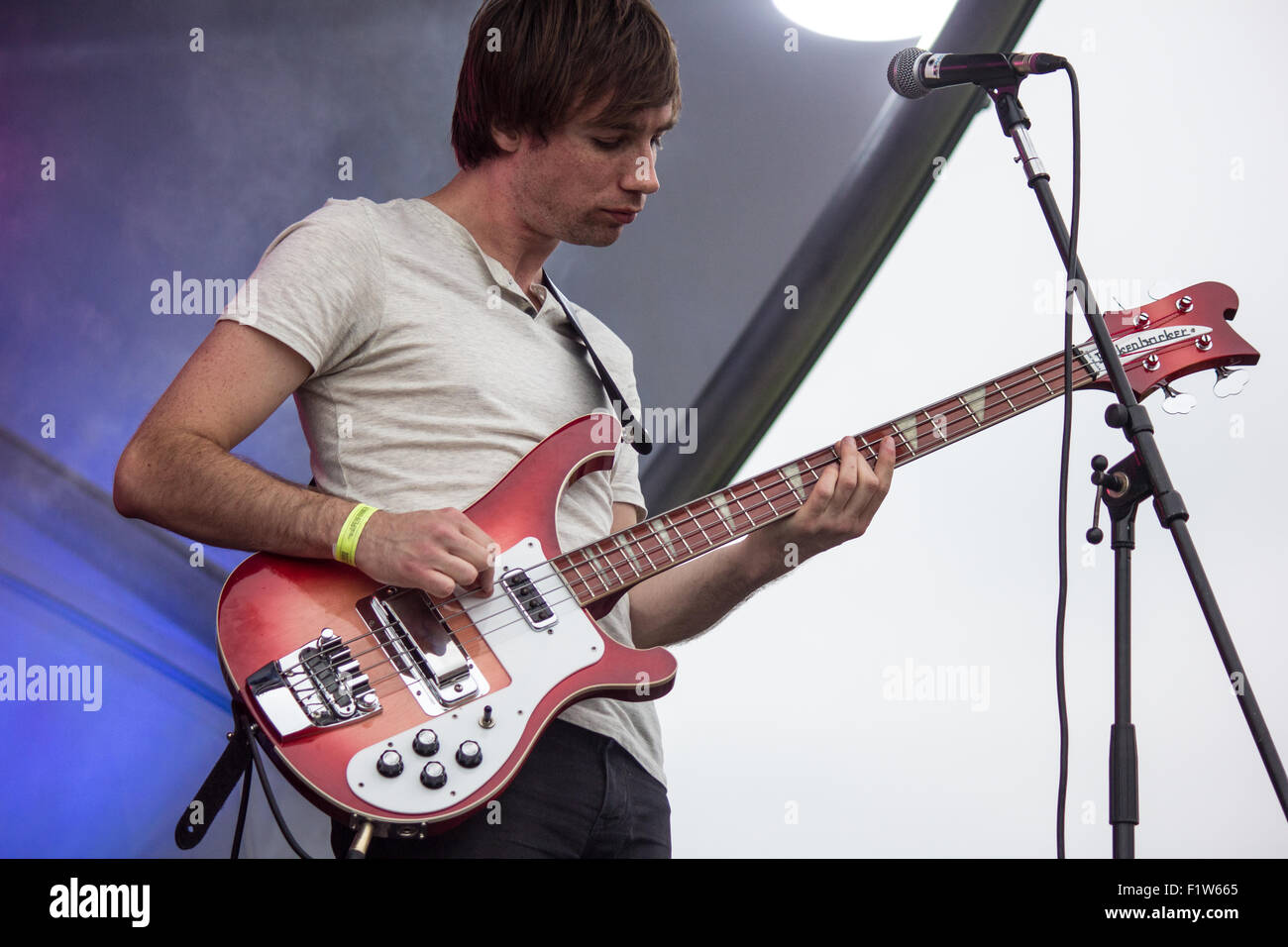 Tom Wells of Kassassin Street playing bass guitar at Victorious Festival 2015. Stock Photo