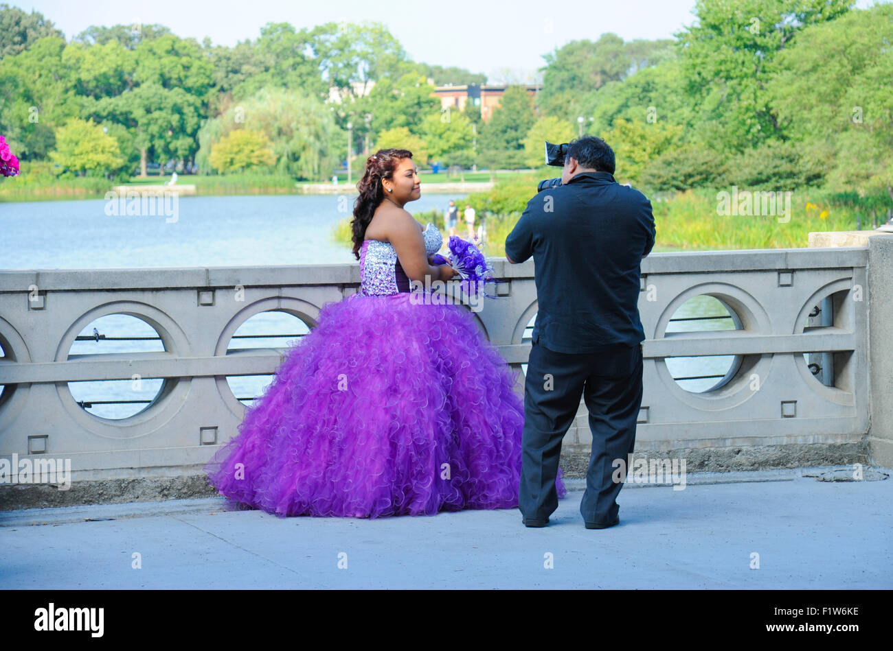 Quinceañera photos being taken of 15 year old Chicago Mexican girl in Humboldt Park, Chicago, Illinois. Stock Photo