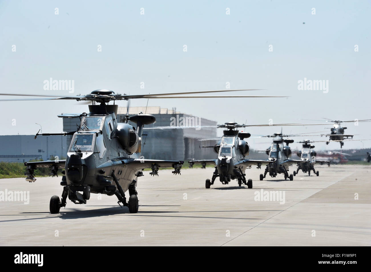 Tianjin, China. 7th Sep, 2015. Gunships practise taking-off for the coming China Helicopter Exposition at a helicopter base of Aviation Industry Corporation of China in the Airport Area of China Pilot Free Trade Zone of Tianjin, north China, Sept. 7, 2015. The exposition will be opened on Sept. 9. © Wang Huan/Xinhua/Alamy Live News Stock Photo