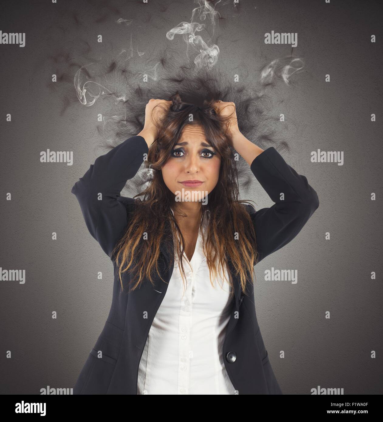 Stressed and desperate businesswoman Stock Photo