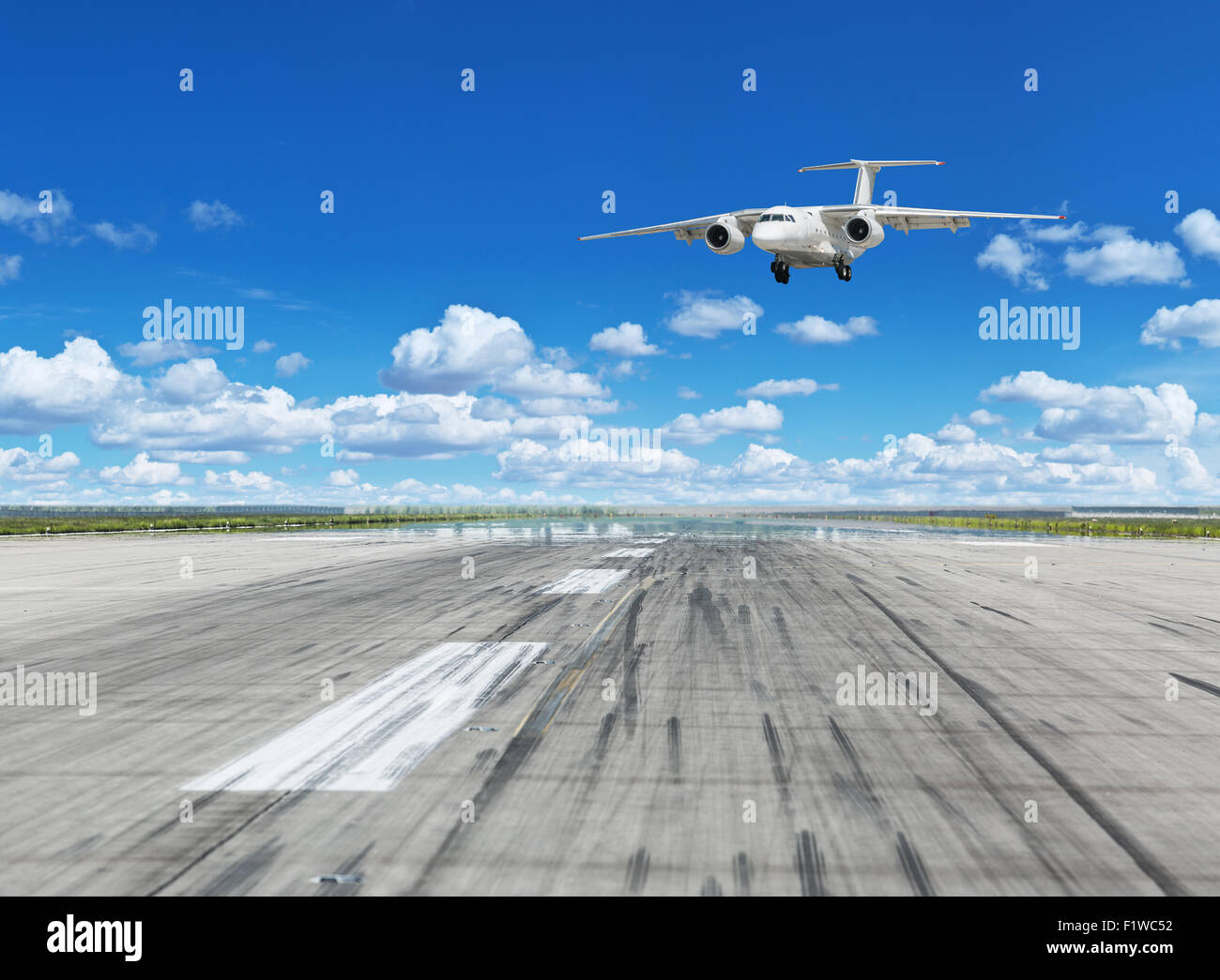 Airplane landing on runaway in the airport. Stock Photo