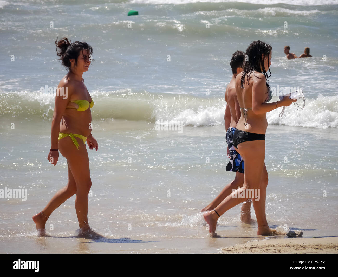 Girls in Bikinis walking on El Arenal Beach, Mallorca, Spain Stock Photo -  Alamy