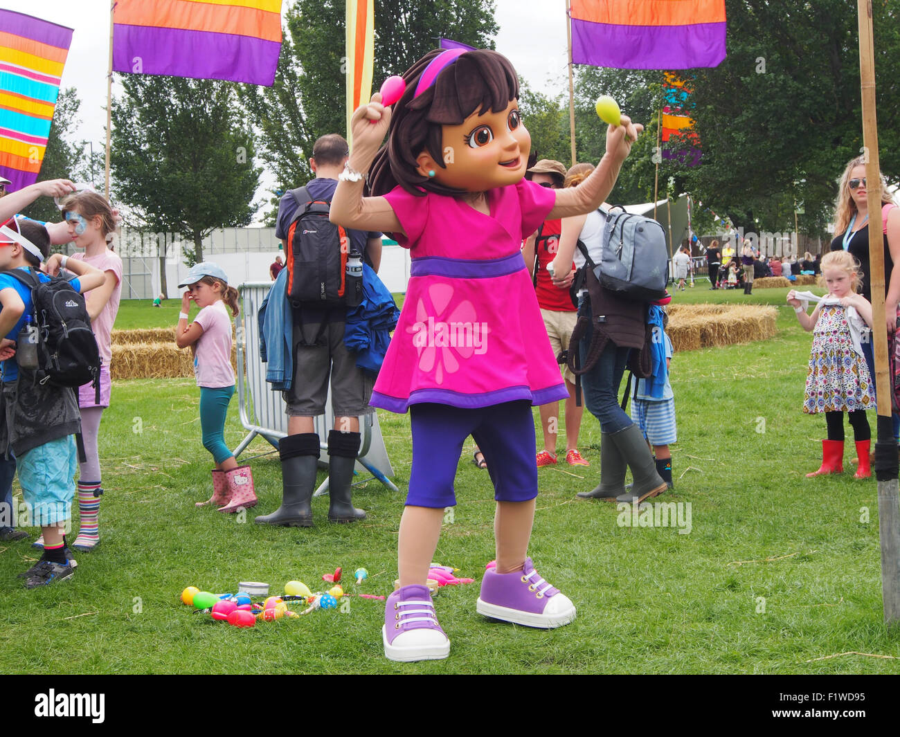 Dora the explorer dancing at a family music festival Stock Photo