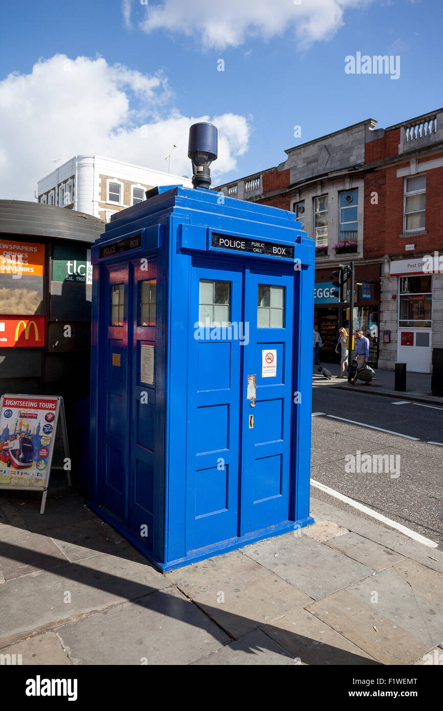 LONDON - JUNE 11, 2014: Public call police box with mounted a modern surveillance camera near Earl's Court tube station in Londo Stock Photo