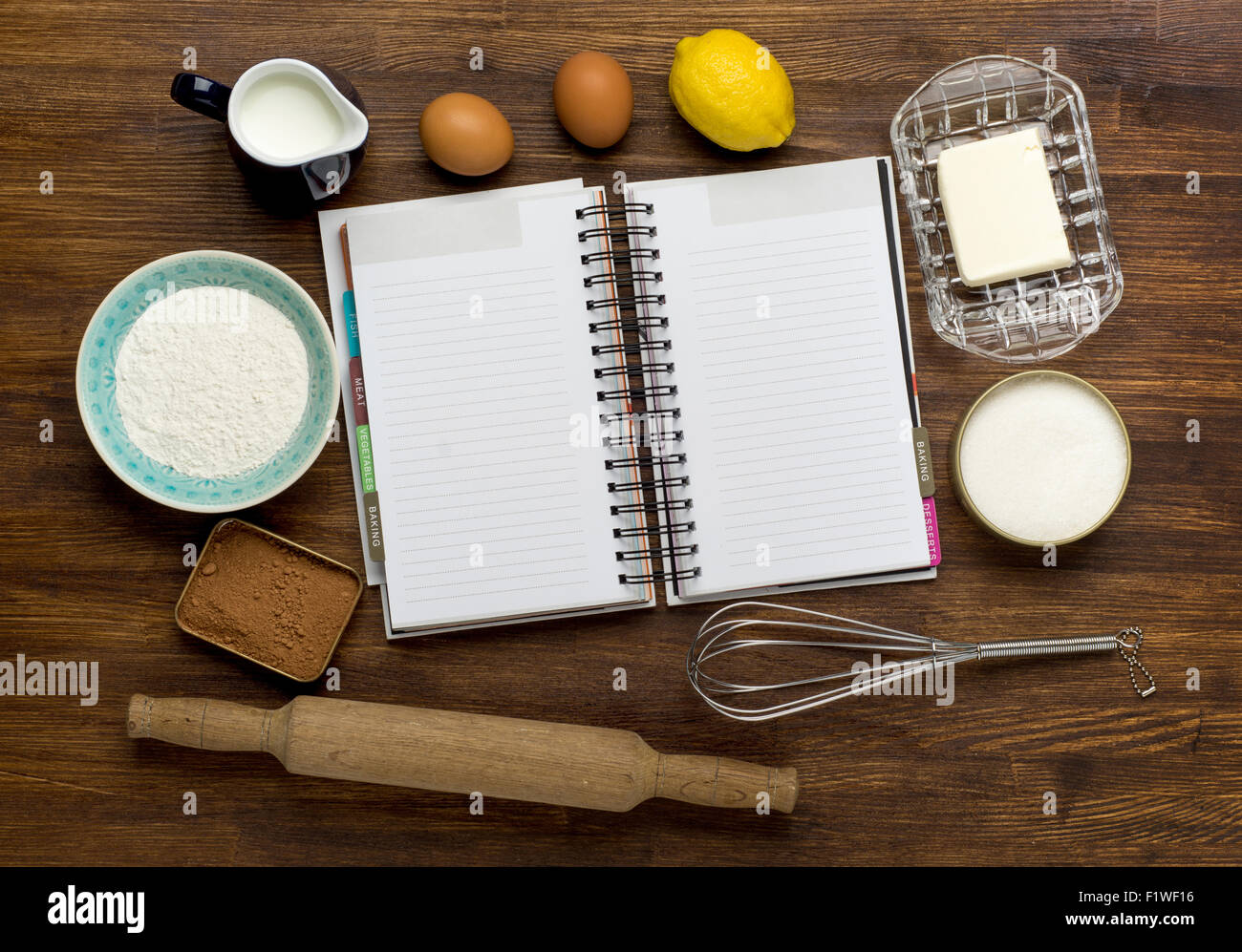 blank recipe book with ingredients on rustic wooden background Stock