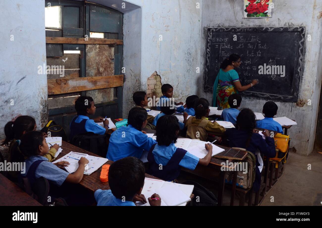 Allahabad, Uttar Pradesh, India. 8th Sep, 2015. Allahabad: School children attend a class at a government-run school on International Literacy Day in Allahabad, India, Monday, Sept. 8, 2015. According to Indian Census 2011, the literacy rate in is 74.04 percent of the total population aged seven and above, though the government has made a law that every child under the age of 14 should get free education, the problem of illiteracy is still at large especially in the rural areas. © Prabhat Kumar Verma/ZUMA Wire/Alamy Live News Stock Photo