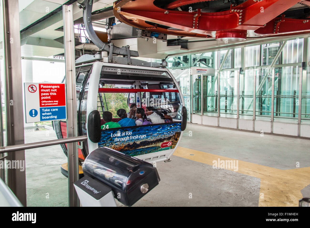 Passengers boarding the Emirates Air Line cable car crossing the River ...