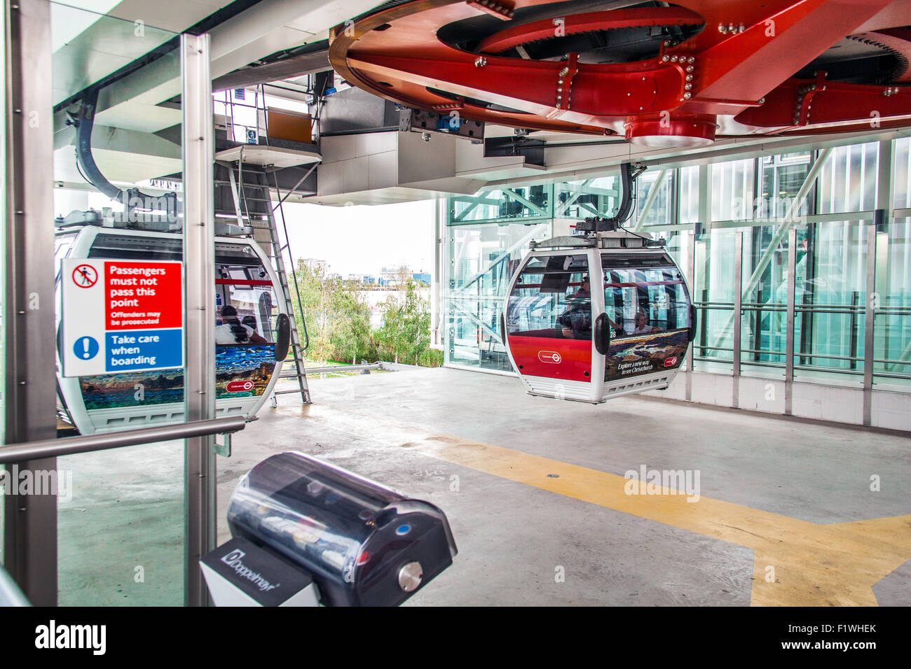 Passengers boarding the Emirates Air Line cable car crossing the River ...