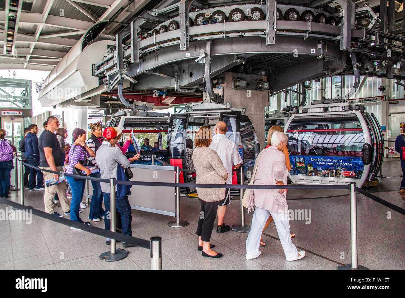Passengers boarding the Emirates Air Line cable car crossing the River ...