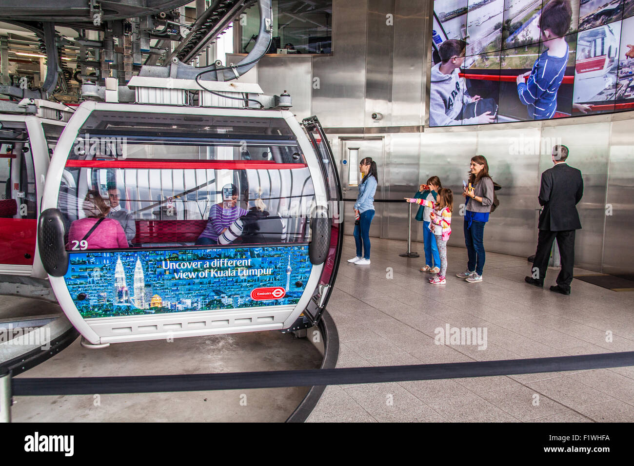 Passengers boarding the Emirates Air Line cable car crossing the River ...