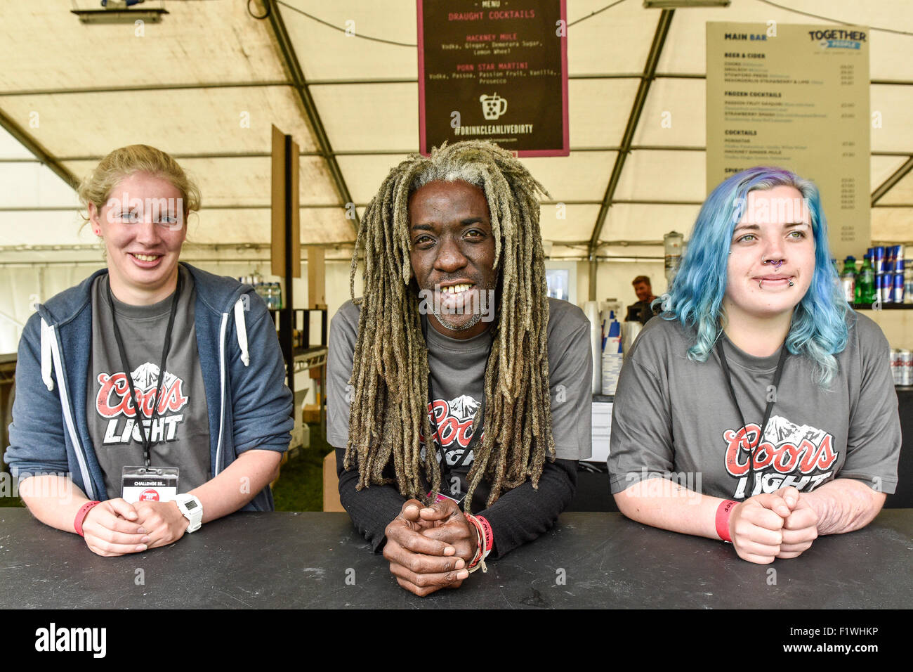 Three happy bar staff workers at Together The People Festival in Brighton. Stock Photo