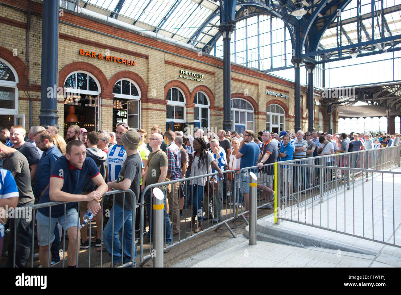 Bighton & Hove football fans travelling from Brighton Rail Station to Falmer Station in transit to the weekend football match. Stock Photo