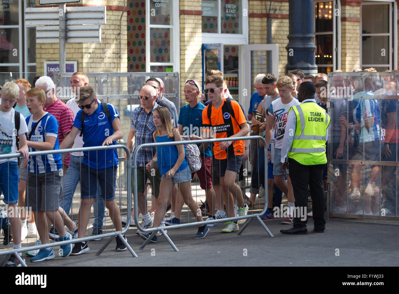 Bighton & Hove football fans travelling from Brighton Rail Station to Falmer Station in transit to the weekend football match. Stock Photo