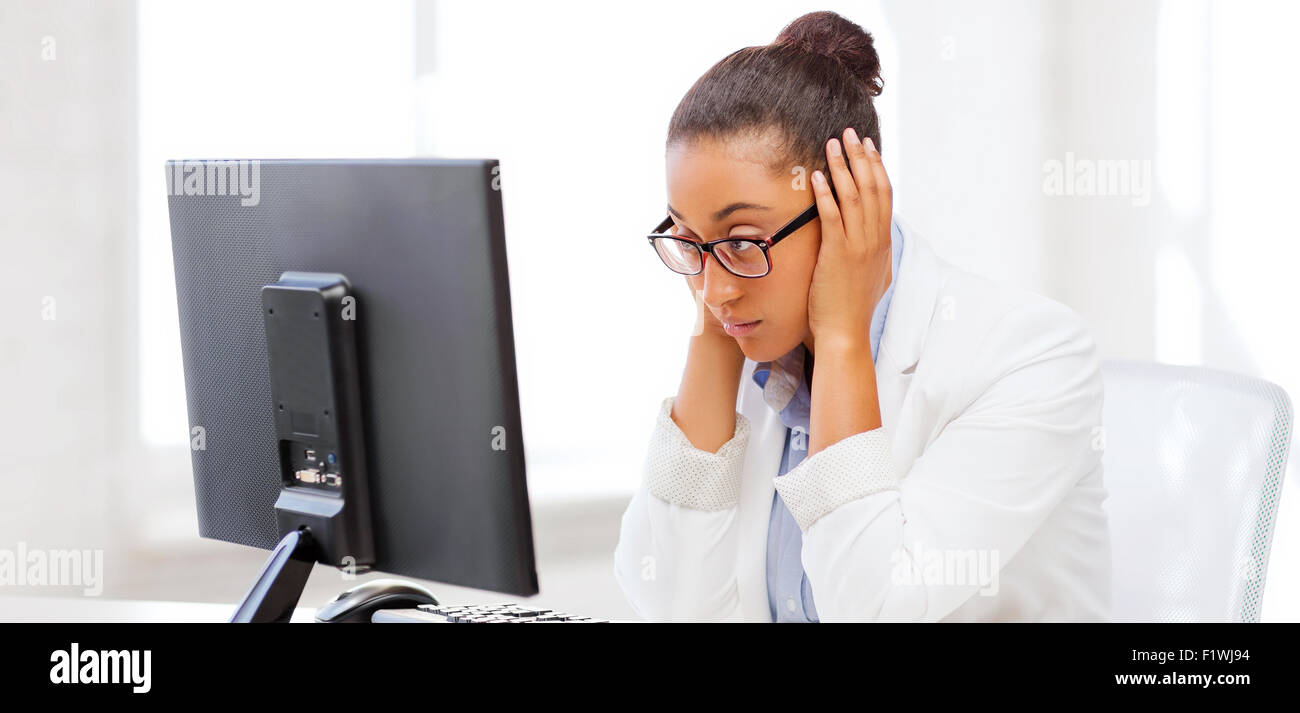 stressed african woman with computer Stock Photo - Alamy