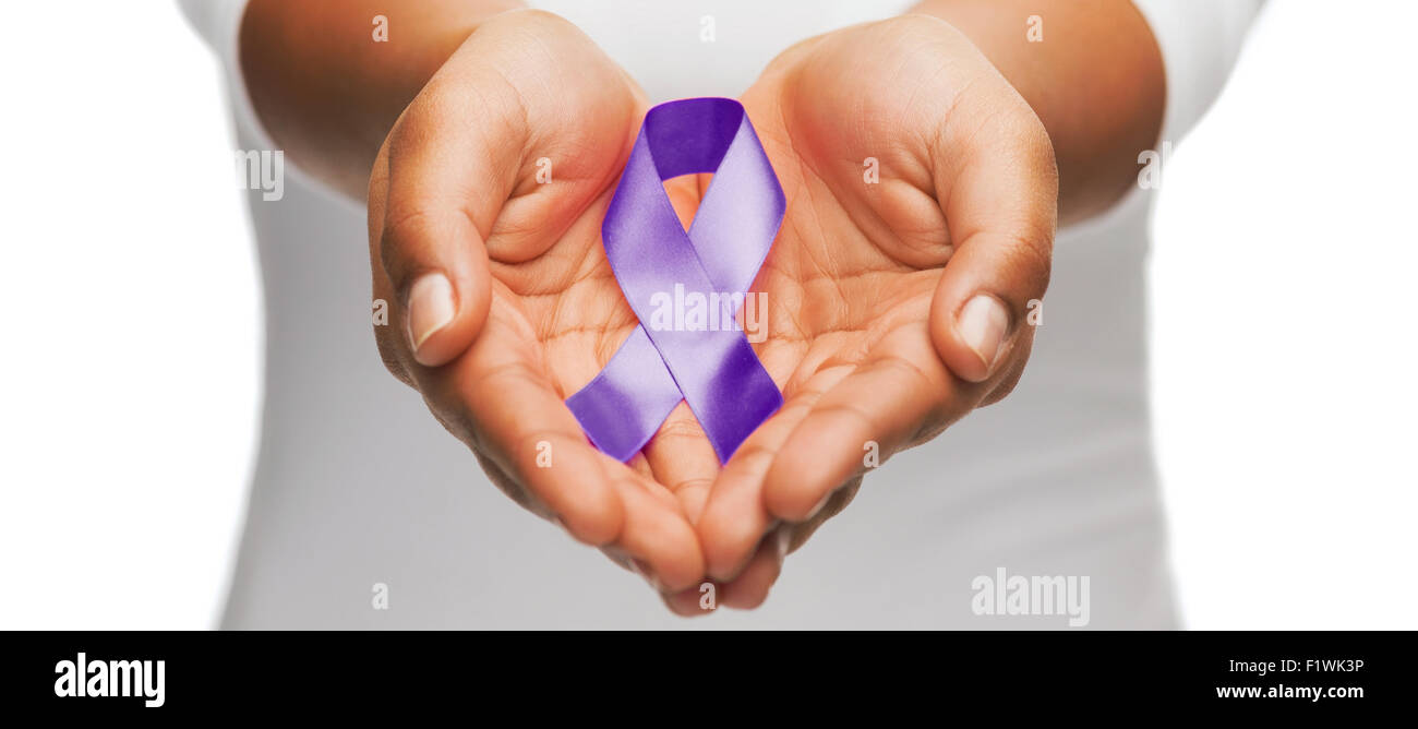 hands holding purple awareness ribbon Stock Photo - Alamy