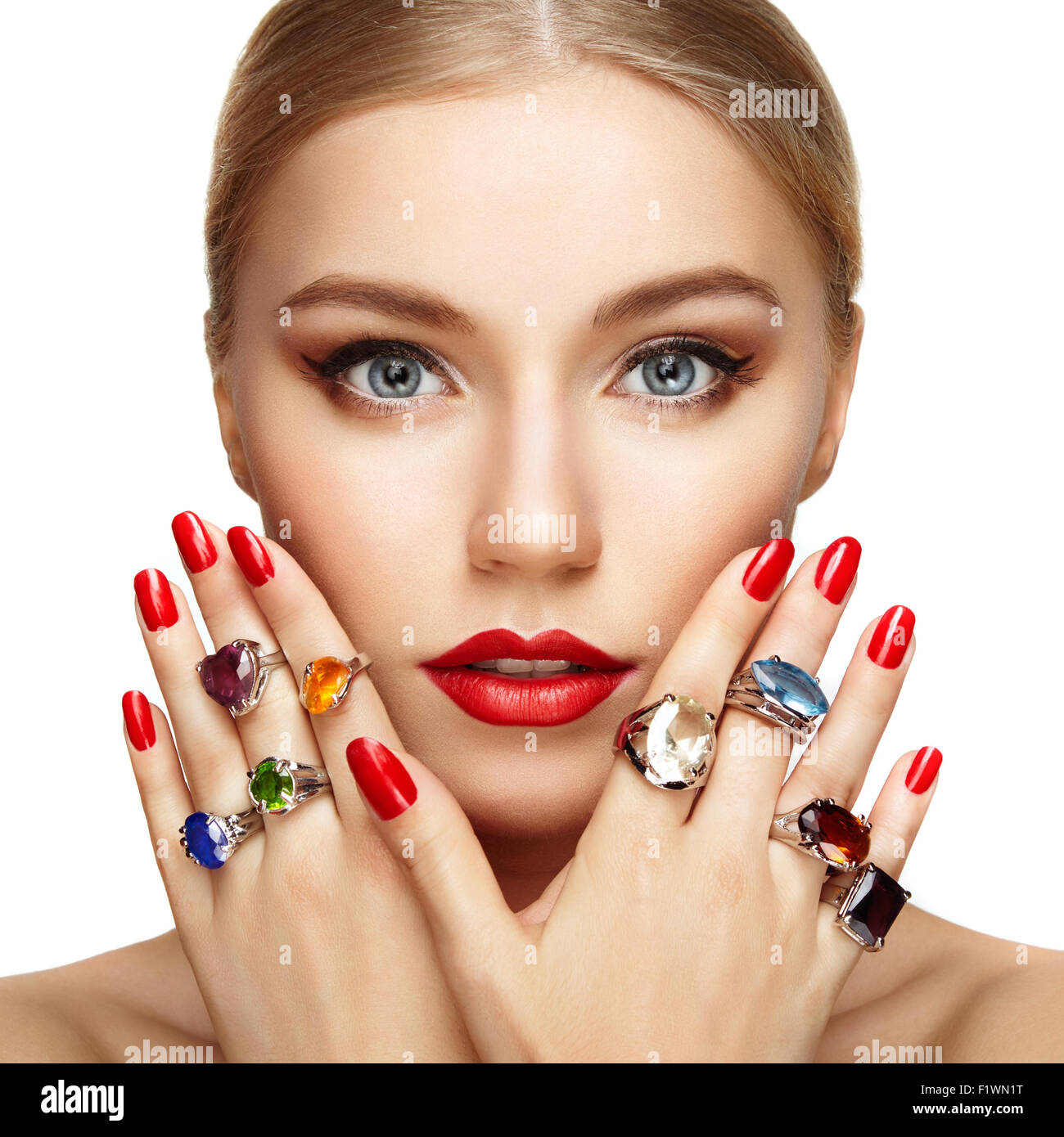 Portrait of beautiful woman with jewelry. Manicure and makeup. Perfect skin. Fashion beauty. Ring. Blonde girl. Close up Stock Photo