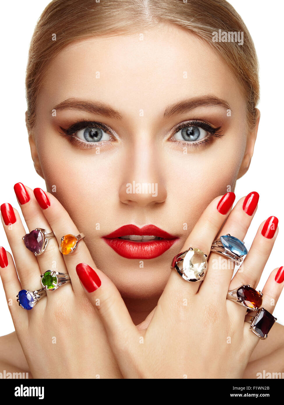 Portrait of beautiful woman with jewelry. Manicure and makeup. Perfect skin. Fashion beauty. Ring. Blonde girl. Close up Stock Photo
