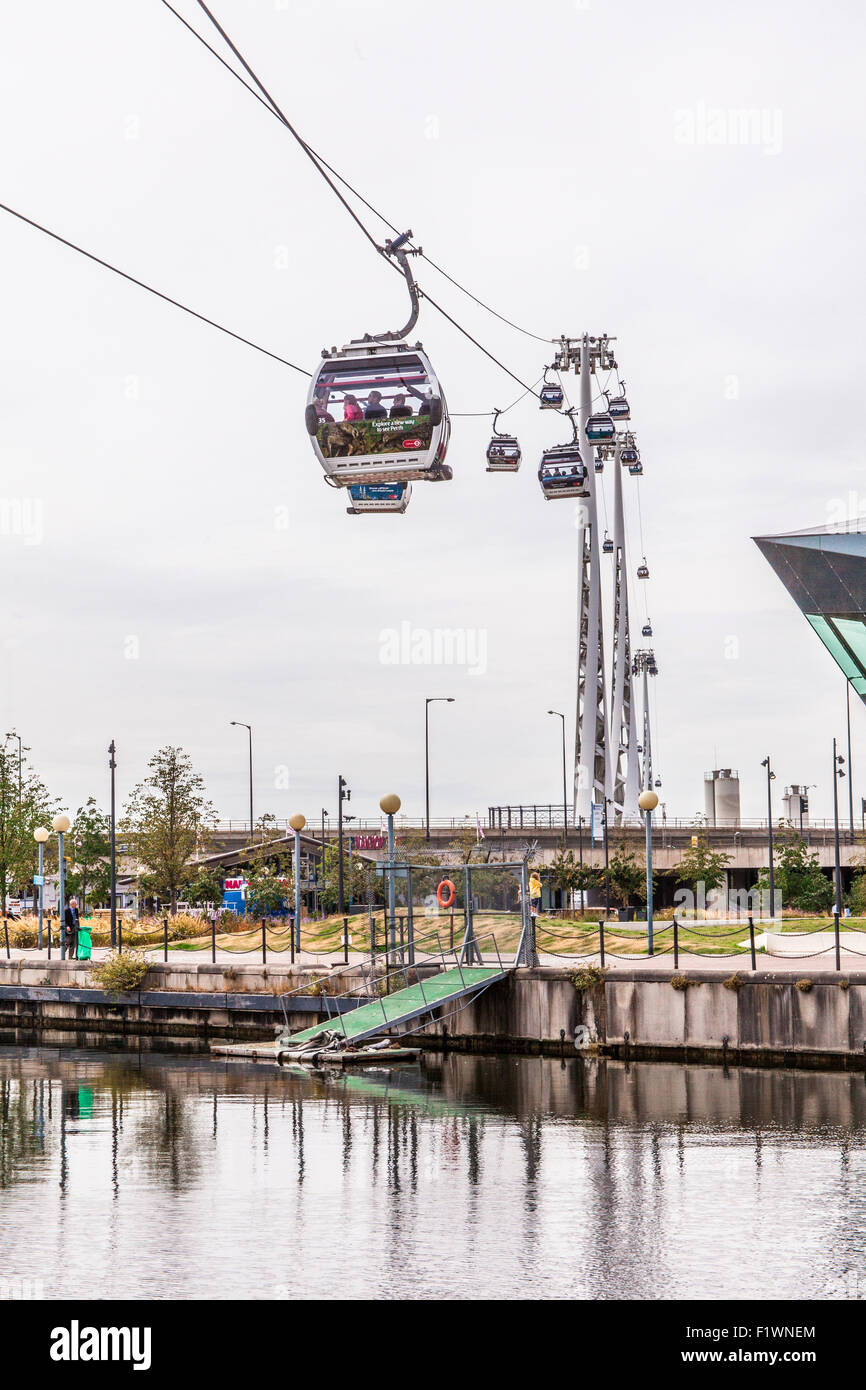 Emirates Air Line cable cars ride across the River Thames from North
