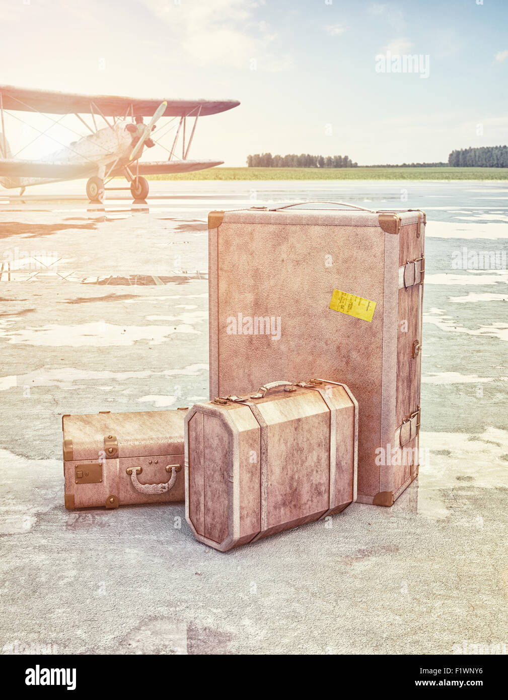 Vintage suitcases and retro airplane on runway. 3d concept Stock Photo