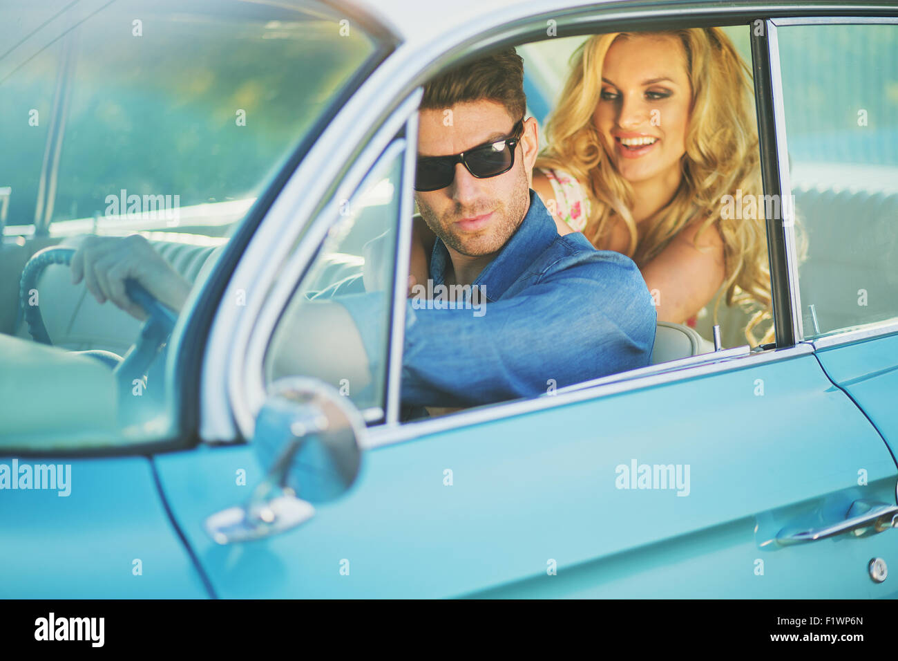 Glad blond woman proud of her boyfriend Stock Photo