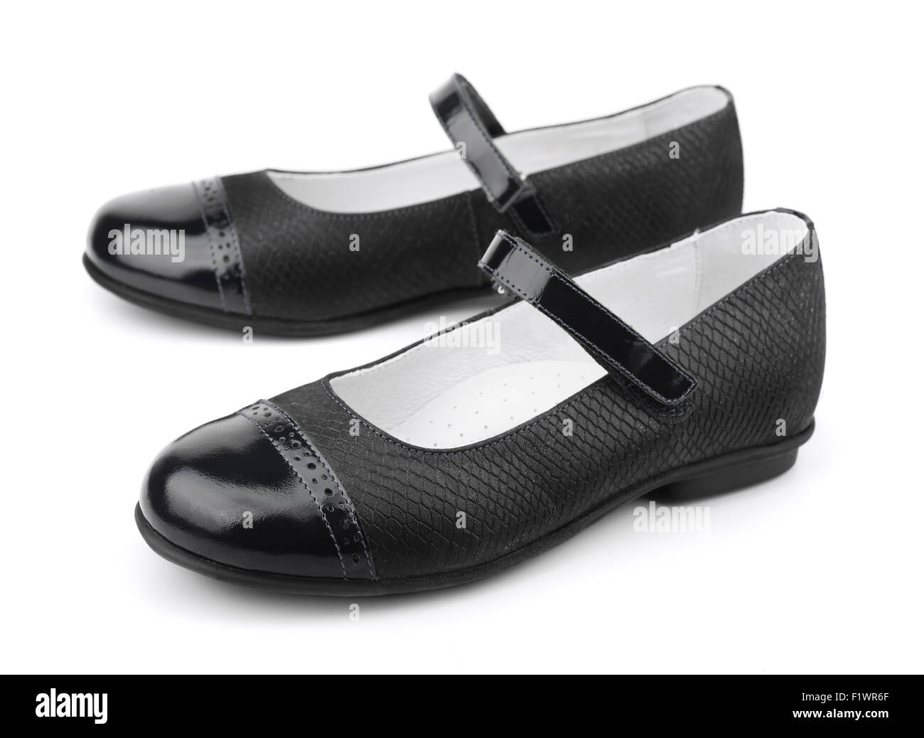 Pair of black female shoes isolated on white Stock Photo - Alamy