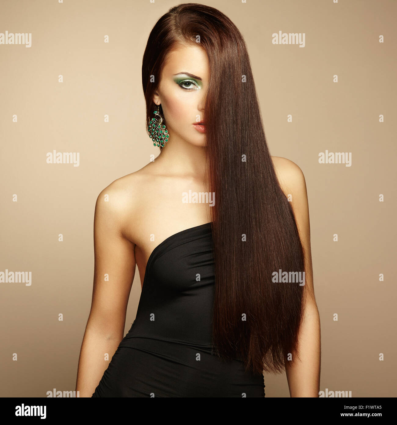 Portrait of beautiful brunette woman in black dress. Fashion photo ...