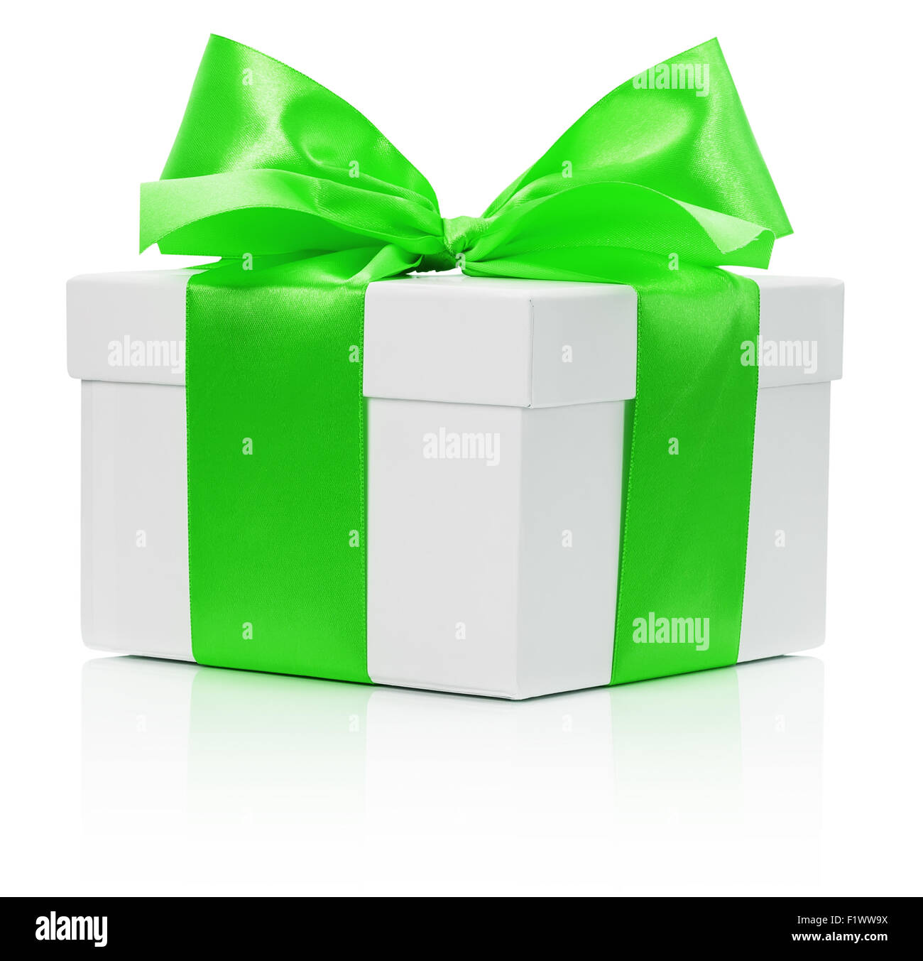 white gift box with green bow isolated on the white background. Stock Photo