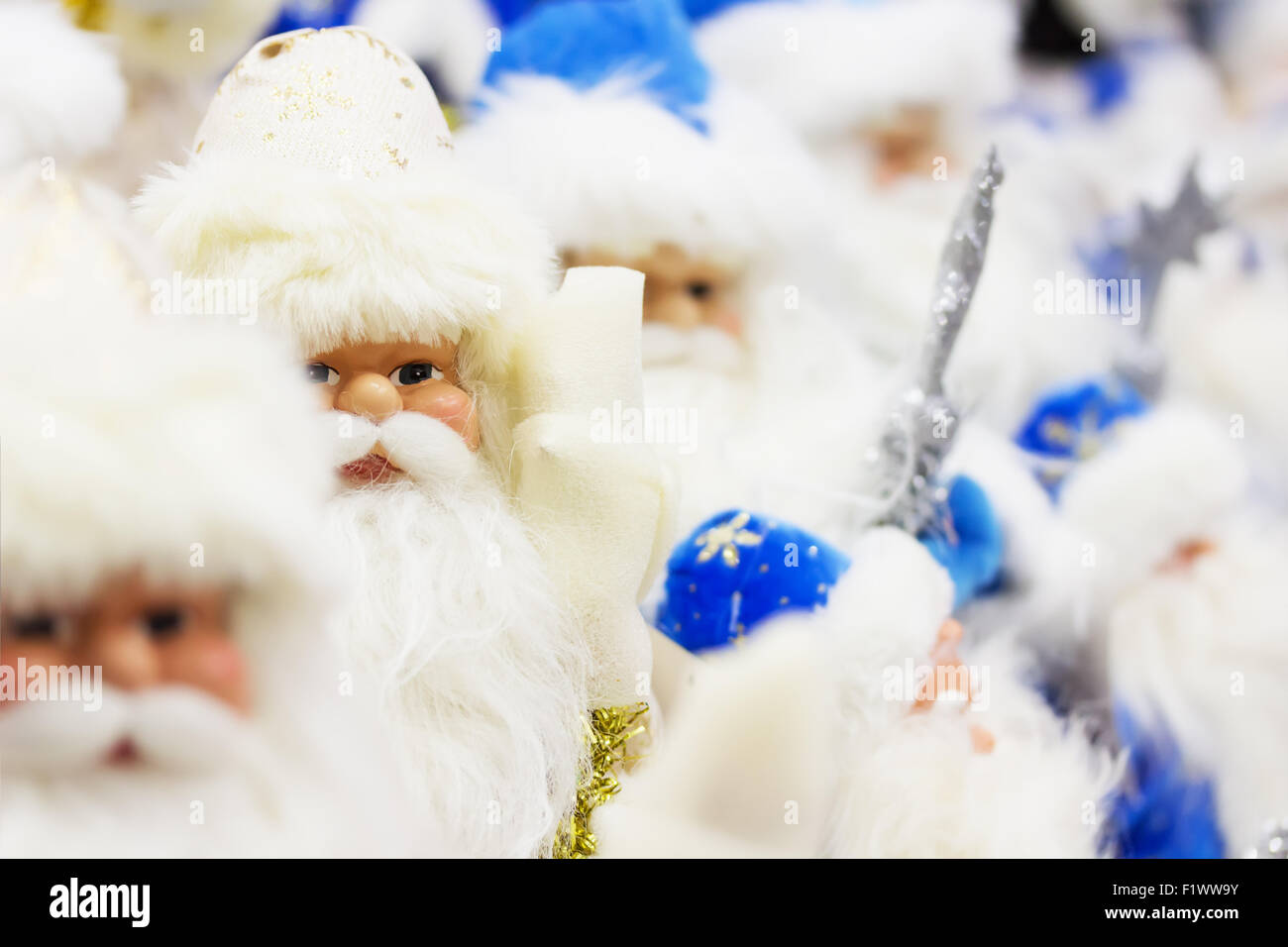 Santa Clauses in blue clothes. Stock Photo