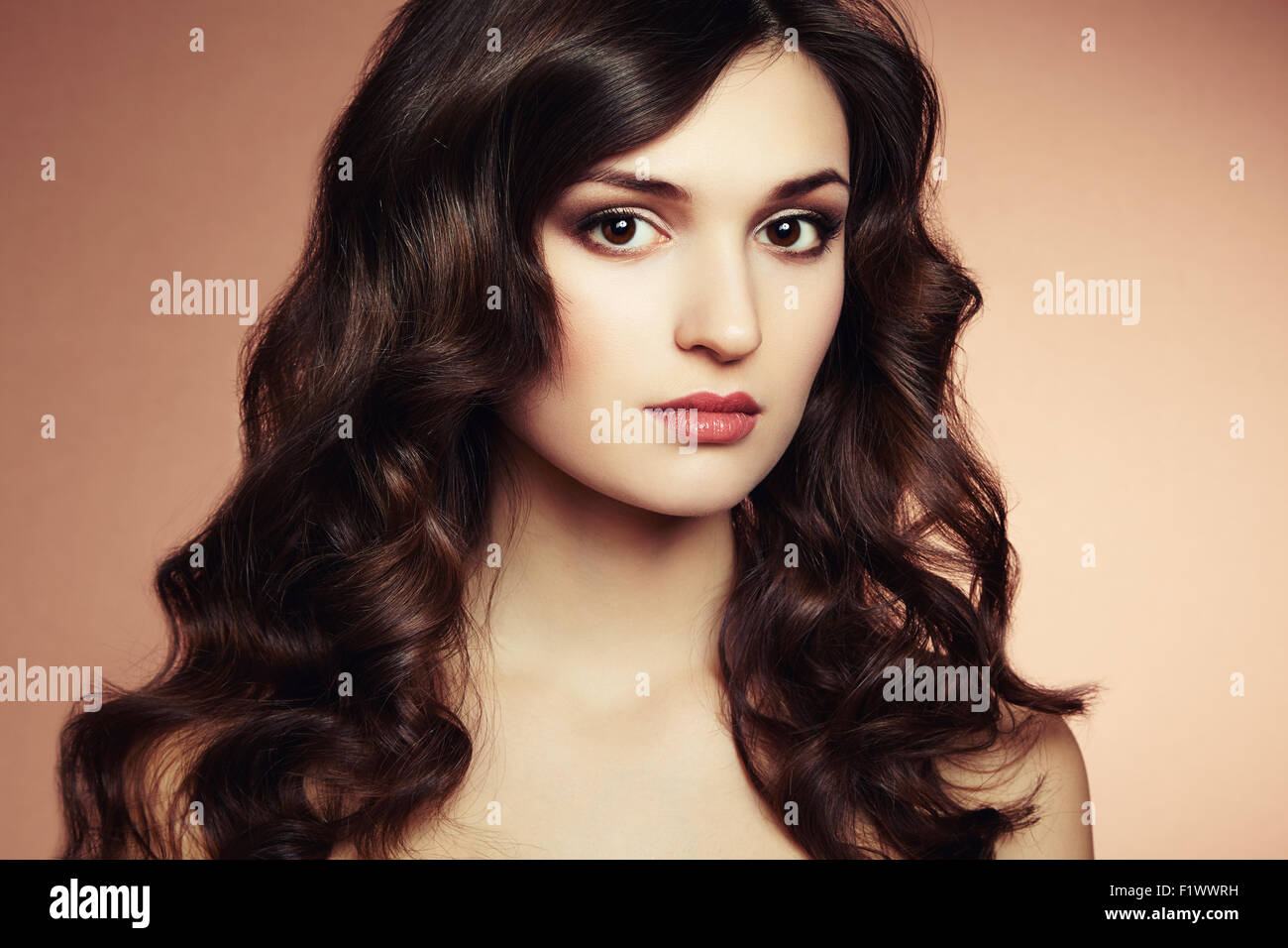 Portrait young beautiful woman with curly hair. Fashion photo Stock ...