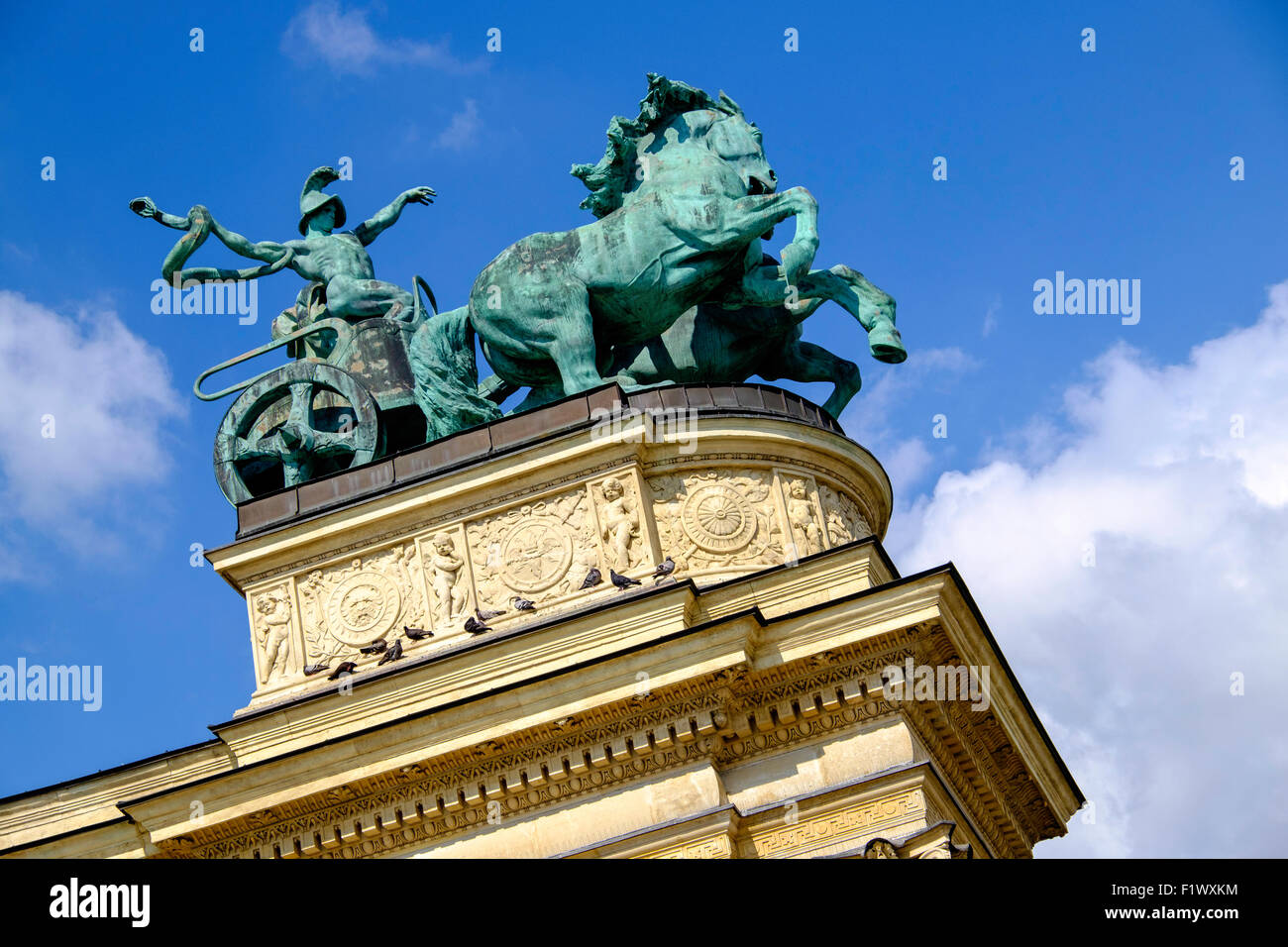 Part of Monument in Heroes Square, Budapest Hungary. The bronze statue of 'War' with chariot and horses is on top of colonnade. Stock Photo