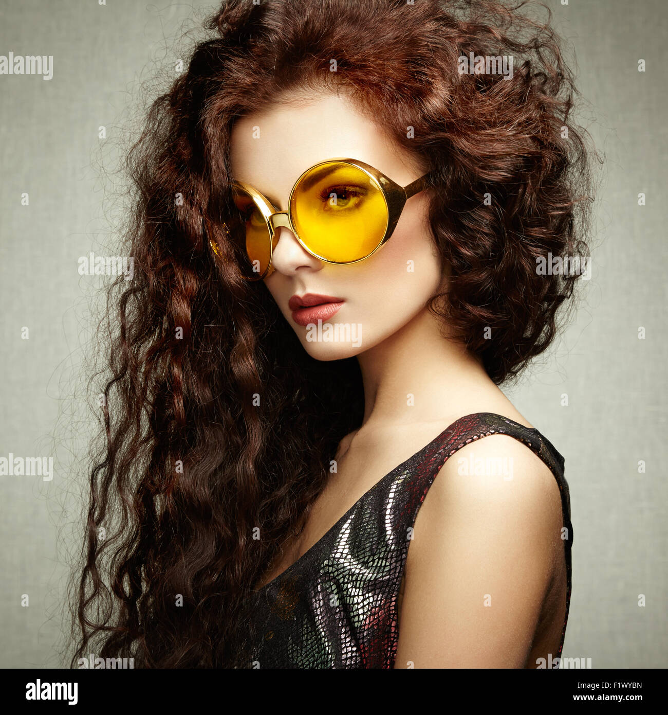 Portrait of beautiful woman in sunglasses on white background. Fashion