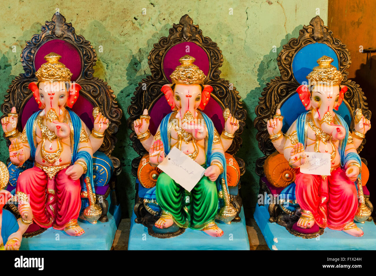 Lord Ganesha idols kept for sale with sold ones tagged with name of buyer ahead of Ganesh Chaturthi festival celebration in Goa. Stock Photo