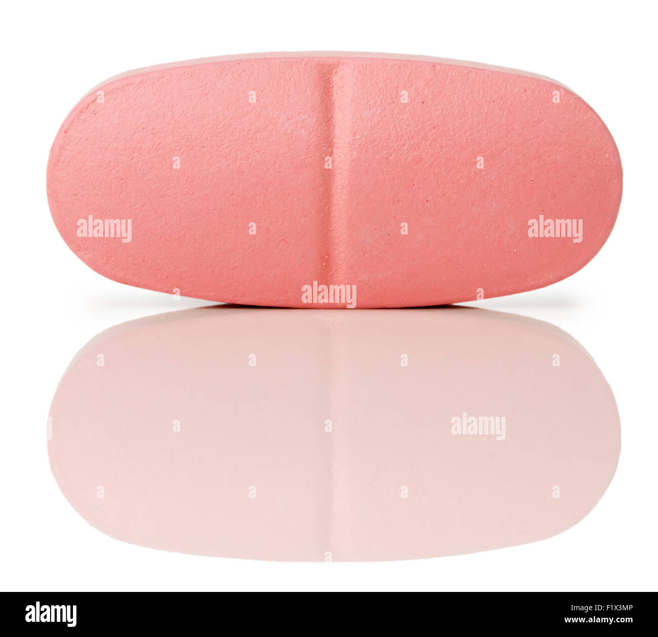 pink pill isolated on a white background. Stock Photo
