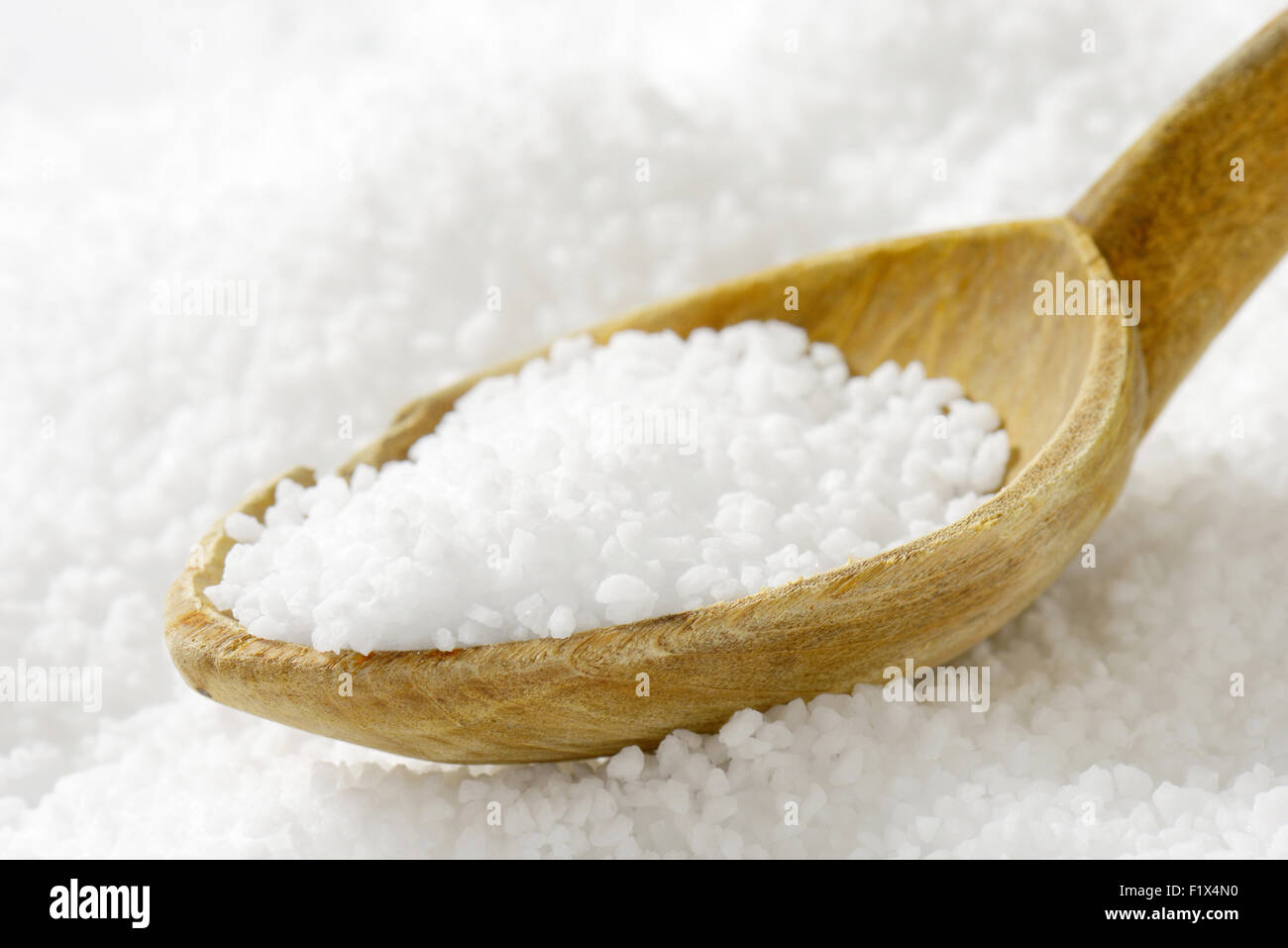 Detail of coarse grained salt and wooden spoon Stock Photo - Alamy