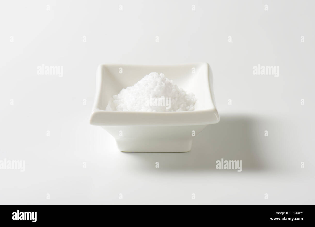 coarse ground salt in white rectangular bowl Stock Photo Alamy
