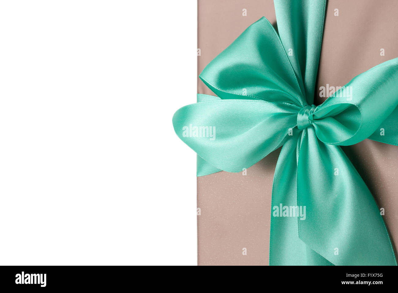 greeting card with turquoise bow on the white background. Stock Photo