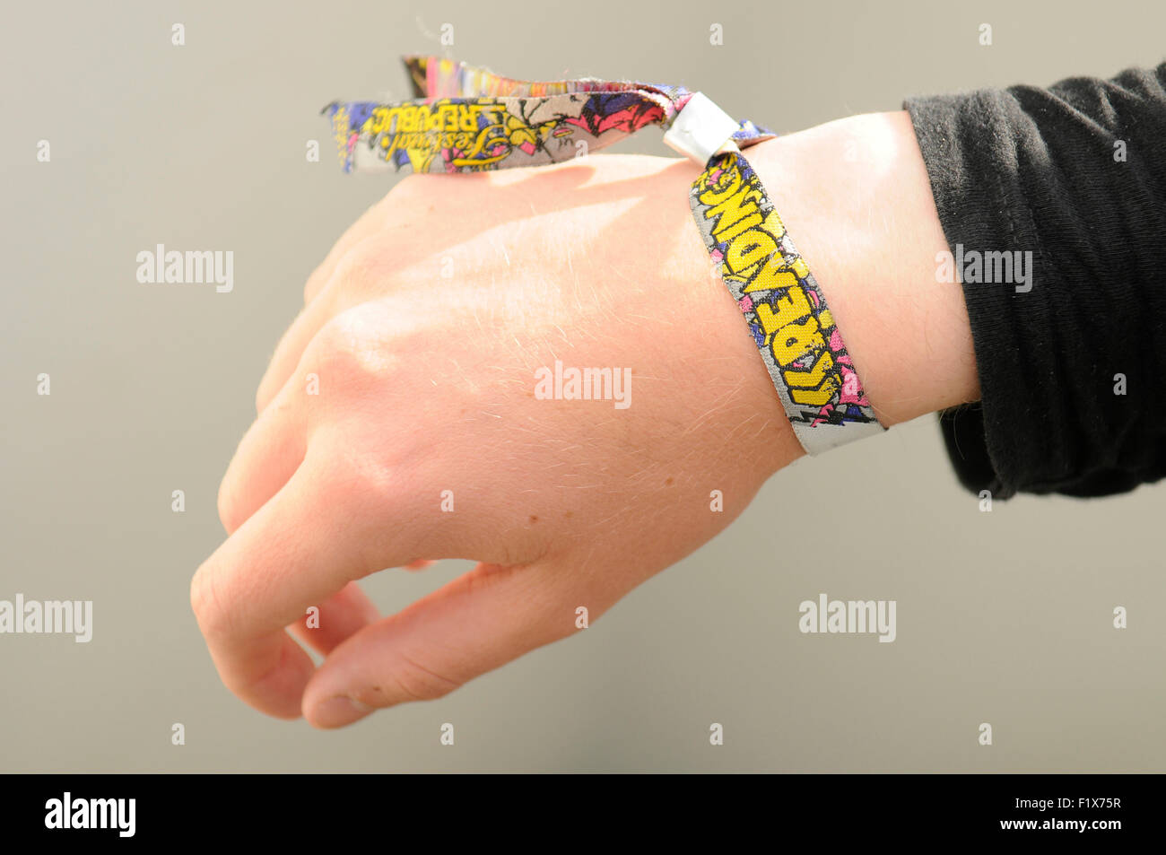 Close-up of a teenager wearing a Reading Festival Wrist Band. Stock Photo