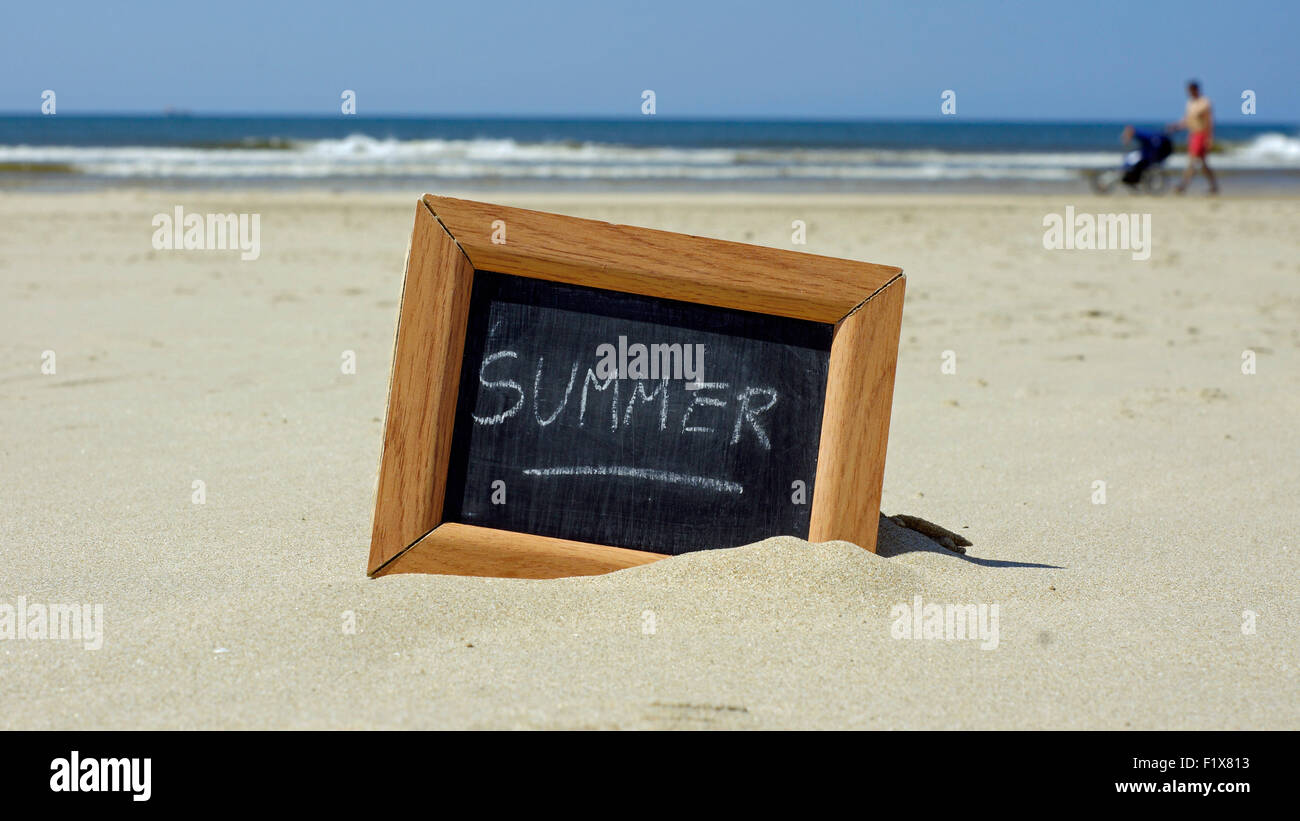Summer written on a chalkboard at the beach Stock Photo - Alamy