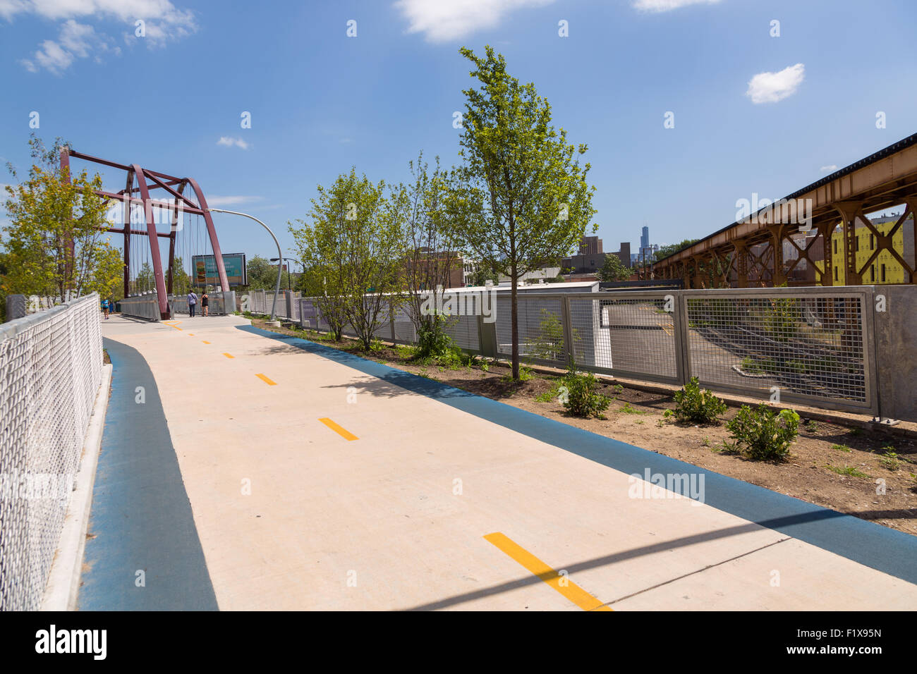 The Milwaukee Avenue bridge along the 606 elevated bike trail, green space and park built on the old Bloomingdale Line in the Wicker Park neighborhood in Chicago, Illinois, USA Stock Photo