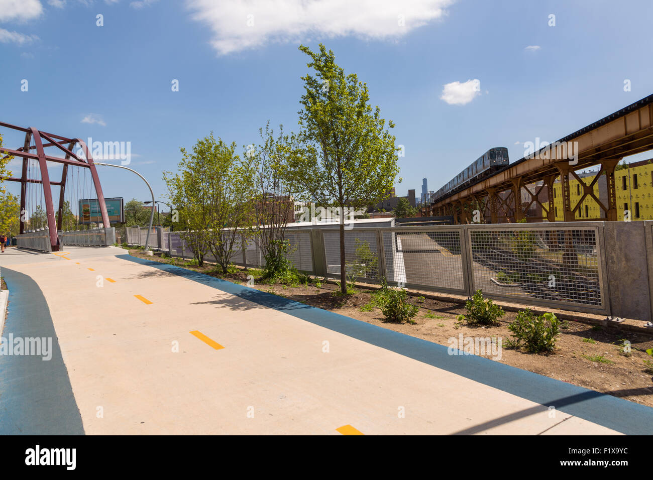 The Milwaukee Avenue bridge along the 606 elevated bike trail, green space and park built on the old Bloomingdale Line in the Wicker Park neighborhood in Chicago, Illinois, USA Stock Photo