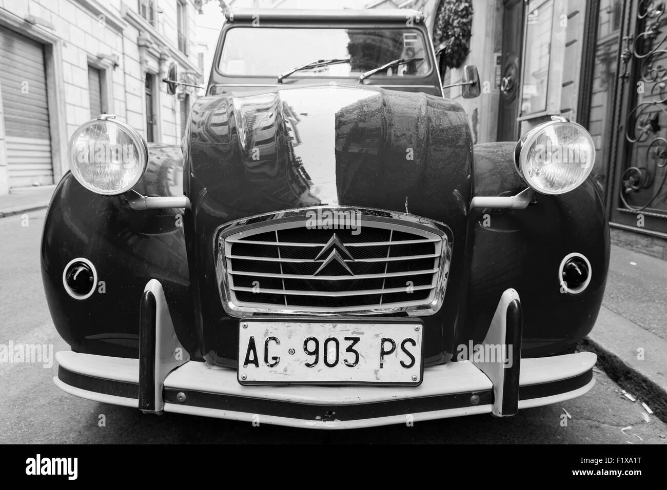 Rome, Italy - August 9, 2015: Old-timer Citroen 2cv6 Special car stands parked on the city roadside, closeup front view with wid Stock Photo
