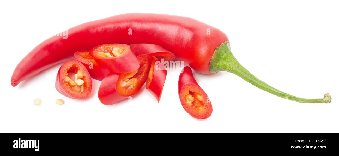 red chilli peppers with slices isolated on the white background. Stock Photo