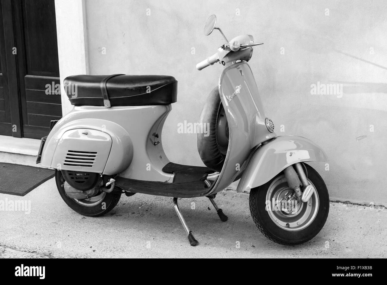 Gaeta, Italy - August 19, 2015: Classical Vespa scooter stands parked near the wall Stock Photo