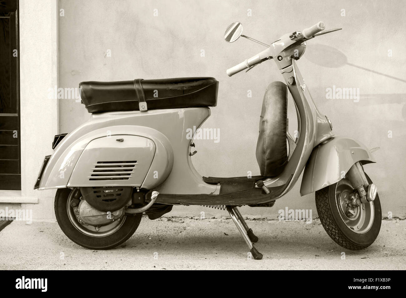 Gaeta, Italy - August 19, 2015: Classic Vespa scooter stands parked near the wall Stock Photo