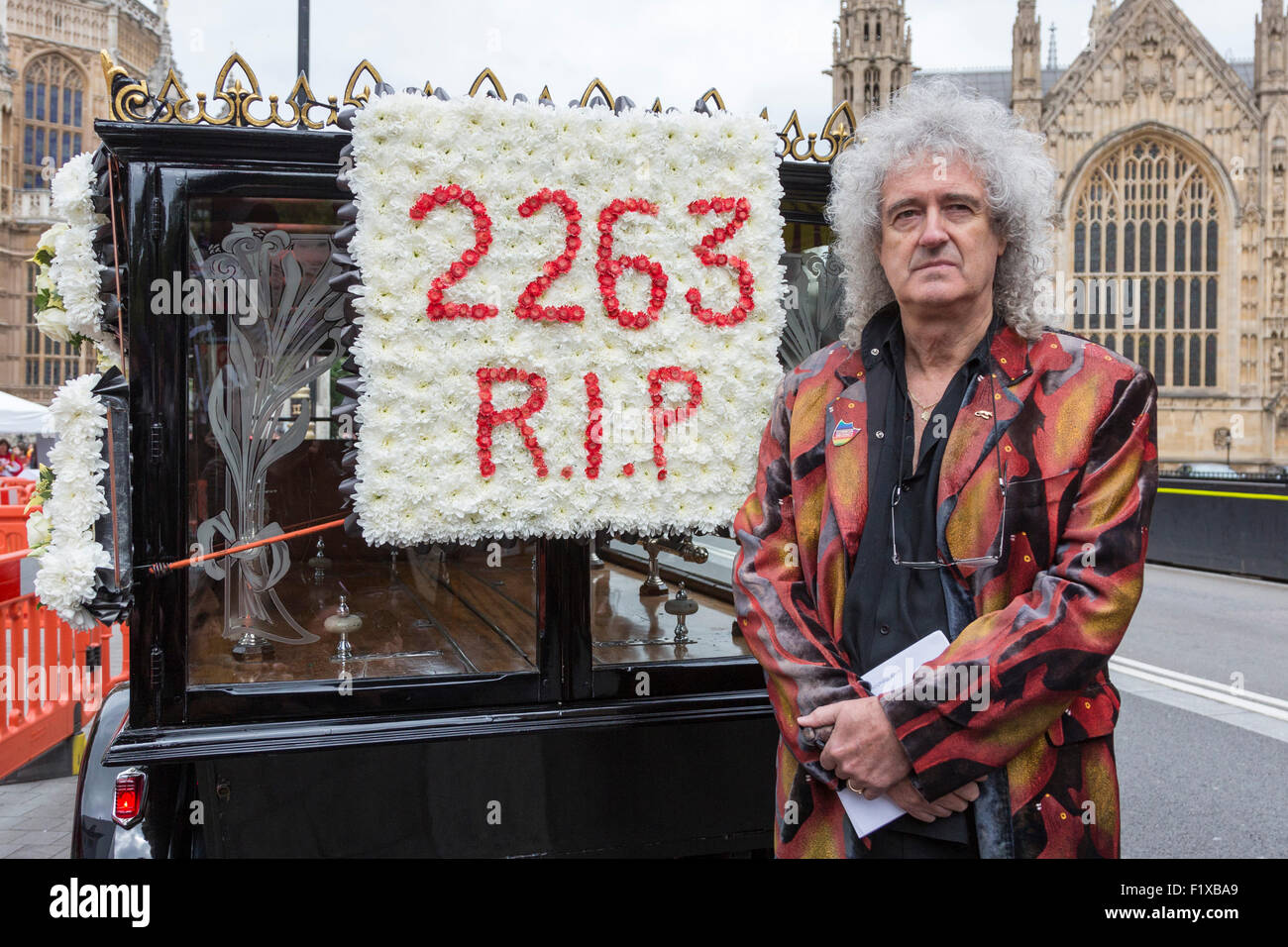 London, UK. 8th September, 2015. Dr Brian May, astrophysicist and guitarist of Queen, joins the Stop the Badger Cull protest at the Houses of Parliament. The protesters, including the animal rights organisation PETA, plan to launch legal action against the culling. Badgers are carriers of Bovine TB (Mycobacterium bovis) and thought to be responsible for spreading the disease. Photo: VIbrant Pictures/Alamy Live News Stock Photo